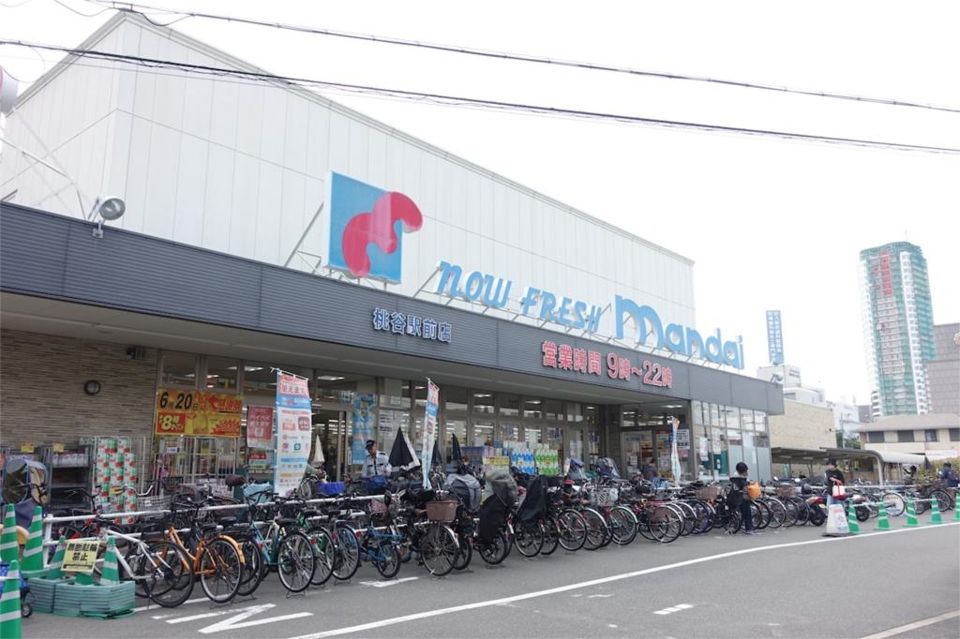 近くのmandai（万代） 桃谷駅前店まで104m（徒歩2分）