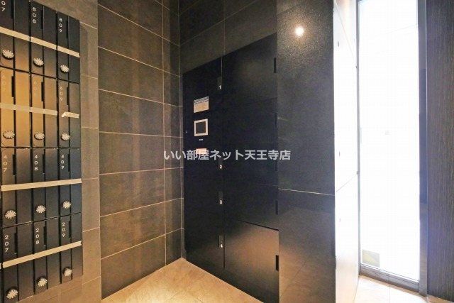 近くのセブンイレブン 大阪大国町駅南店まで221m（徒歩3分）