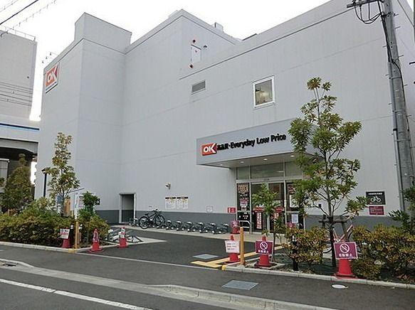 近くのOKストア 梅屋敷店まで405m（徒歩6分）