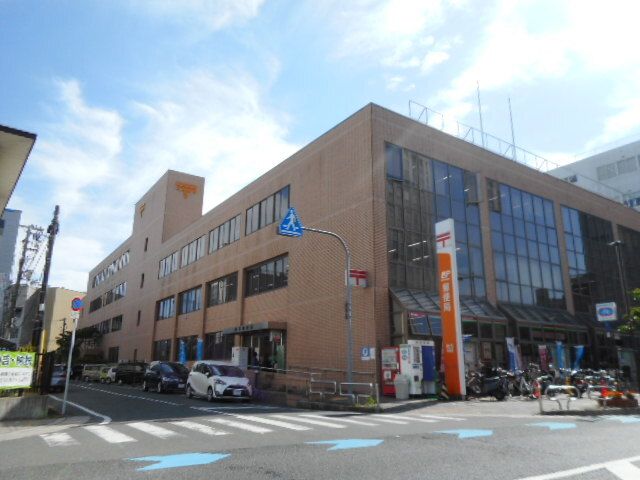 近くの枚方郵便局様まで750m（徒歩10分）