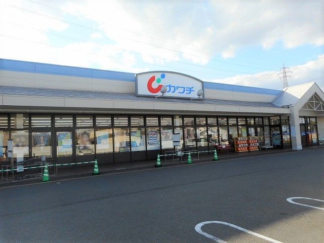 近くのカワチ薬品　穂高店まで700m（徒歩9分）