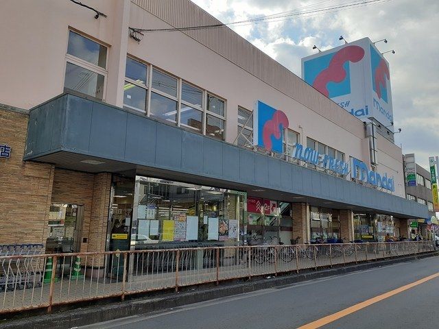 近くの万代寝屋川西店様まで1,100m（徒歩14分）