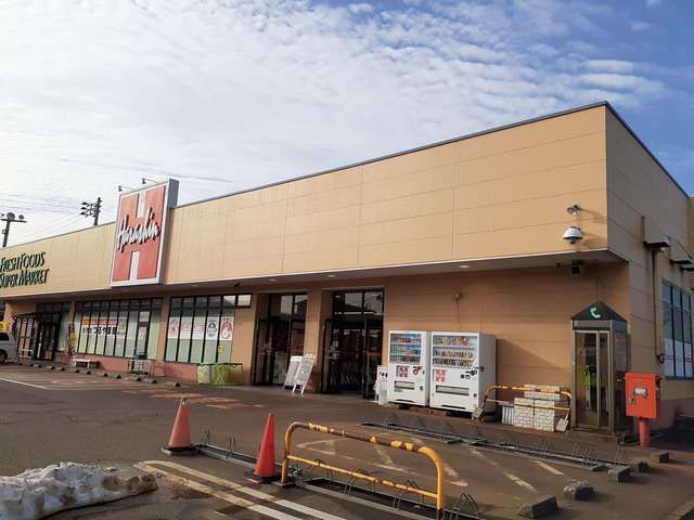 近くの原信春日山店まで1,100m（徒歩14分）